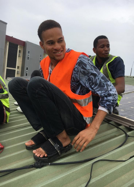 Abisayo and his team installing solar system in an apartment