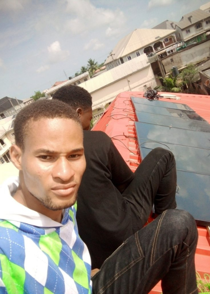 Abisayo and his team installing solar system in an apartment