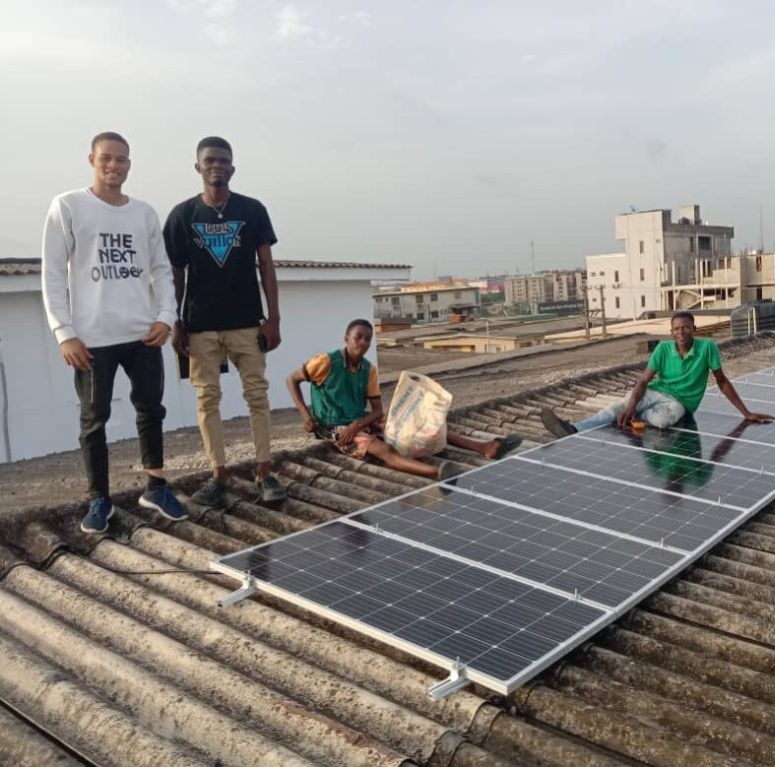 Abisayo and his team installing solar system in an apartment