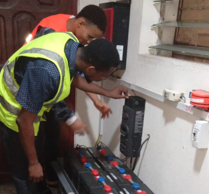 Abisayo and his team installing solar system in an apartment